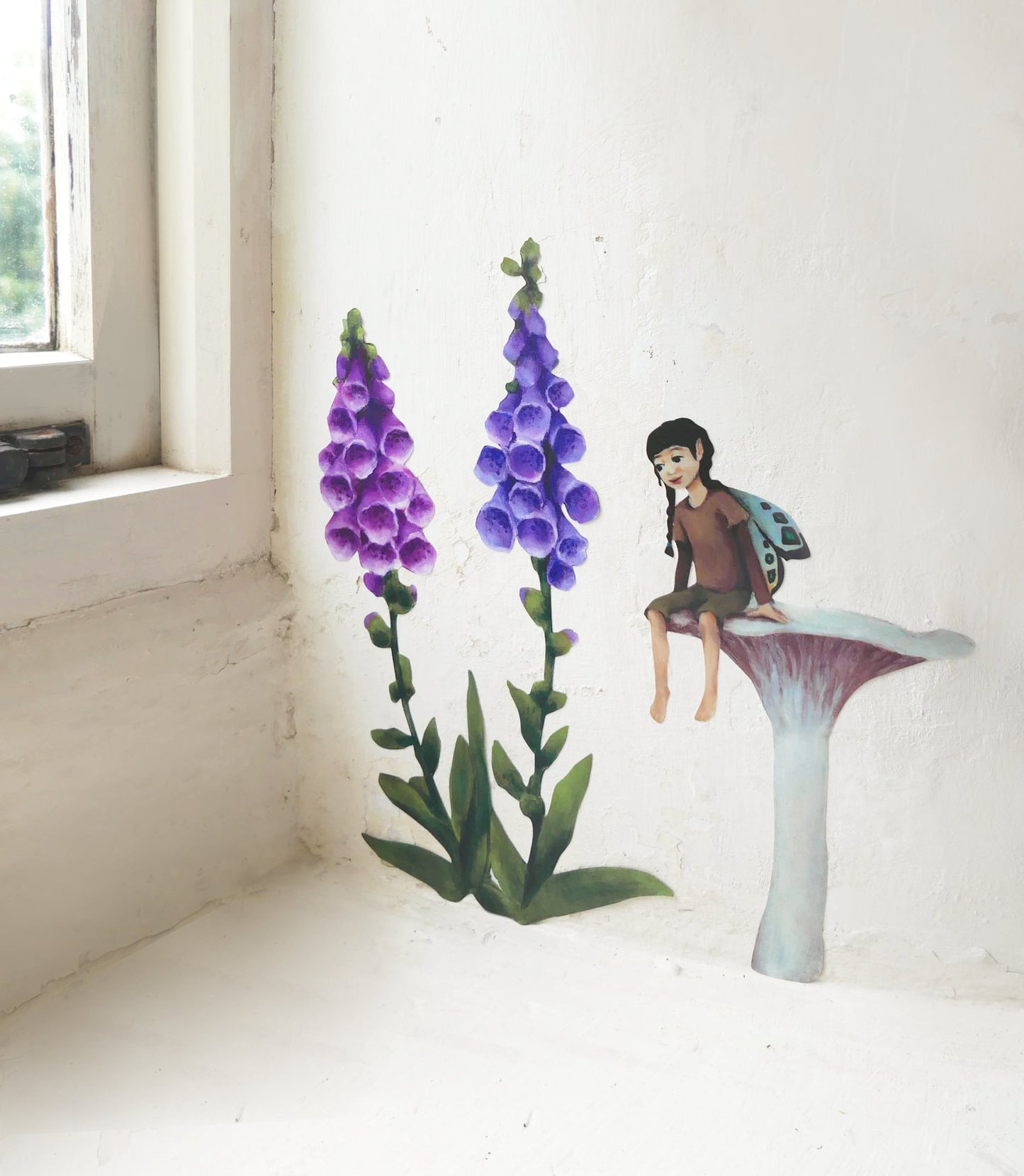 fairy resting on a mushroom