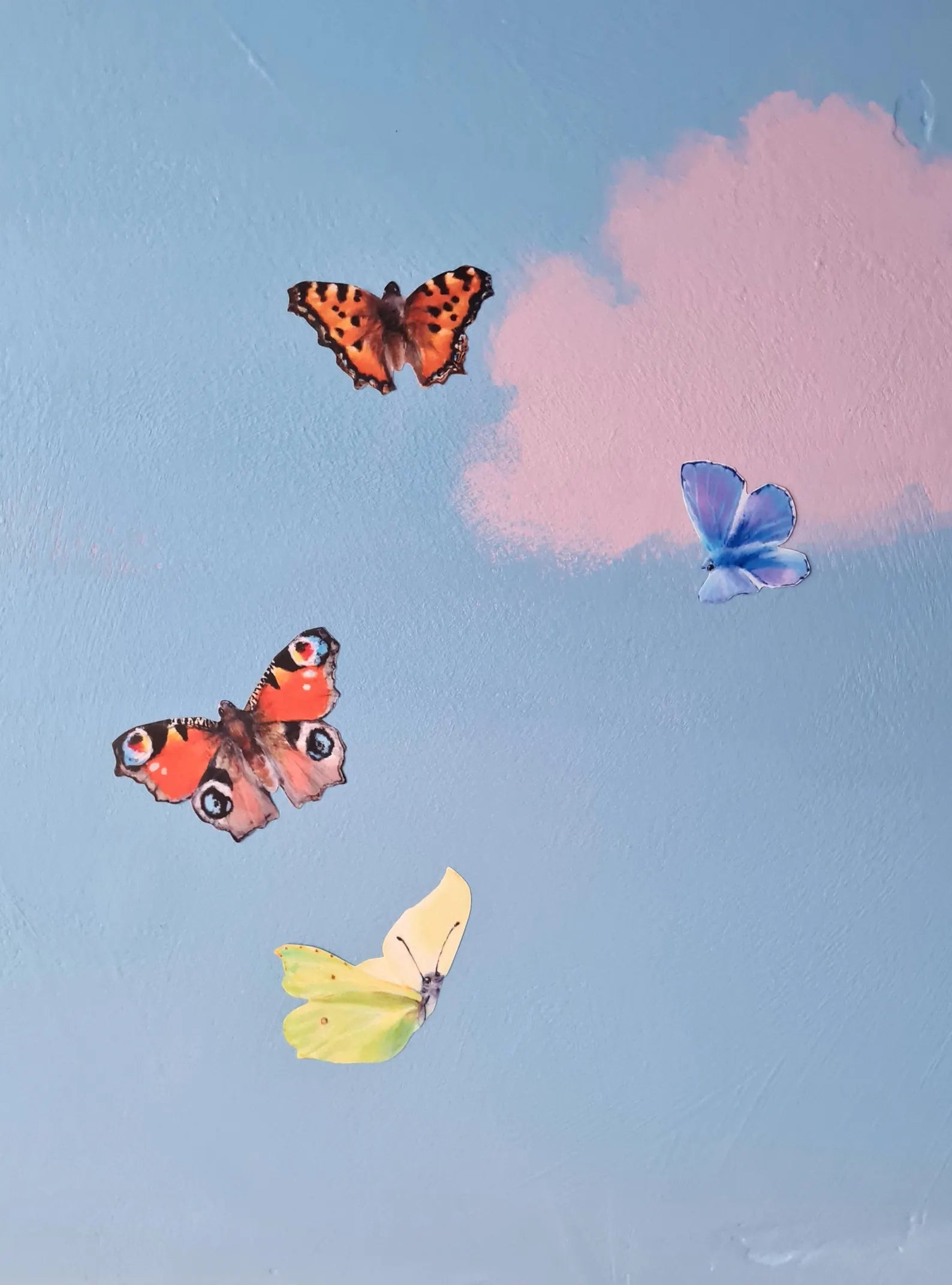 4 butterfly decals stuck on a hand painted ceiling mural