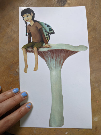 fairy resting on a mushroom