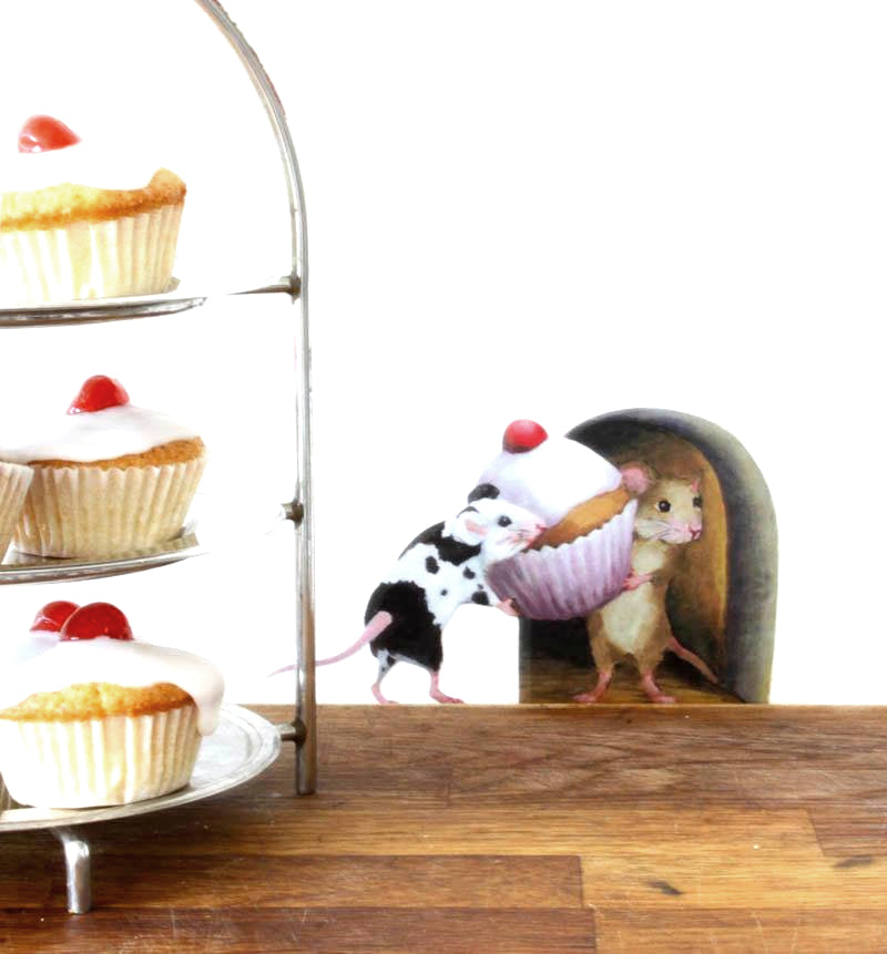 wall decal of 2 mice carrying a cake into a mouse hole, with real cakes on a stand in the foreground
