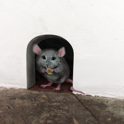 fabric wall decal featuring a mouse holding a piece of cheese i a mouse hole