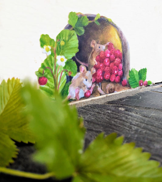 wall sticker showing 2 mice collecting wild strawberries and one feeding a snail, with wild strawberry leaves in the foreground